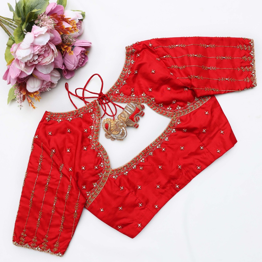 A stunning blend of red and gold, this bridal blouse Stitching