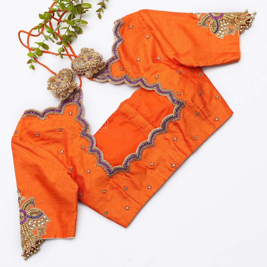Bringing sunshine vibes with this vibrant orange blouse Stitching