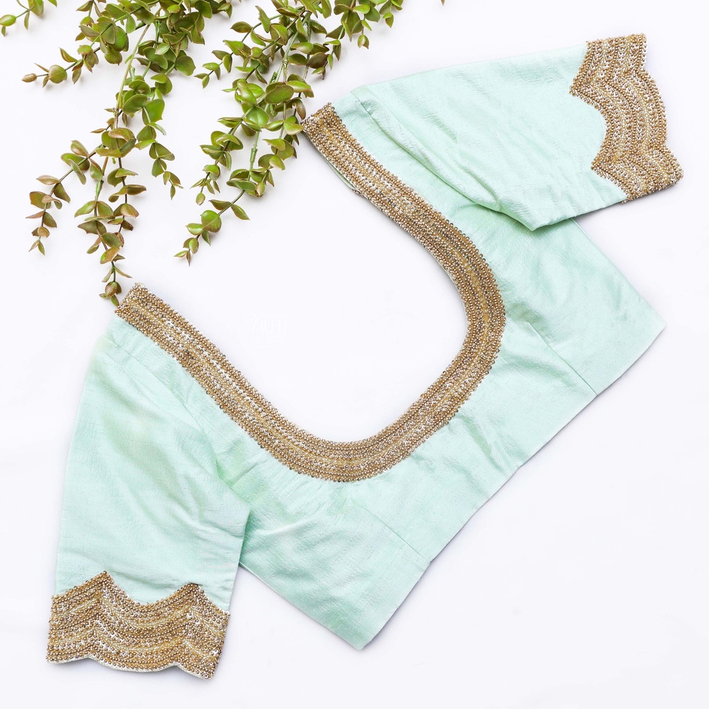 Exquisite craftsmanship meets refreshing hues in this mint green blouse Stitching