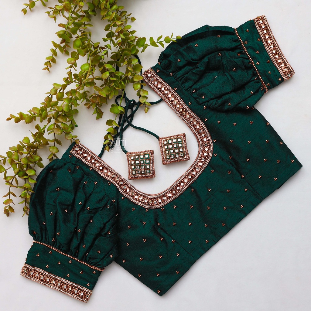 Featuring intricate green color embroidery bridal blouse Stitching