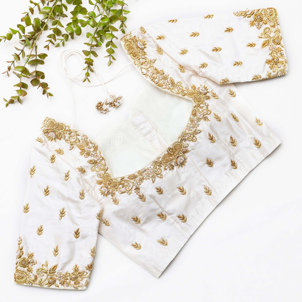 Feeling chic and elegant in my white blouse with gold embroidered details. Stitching
