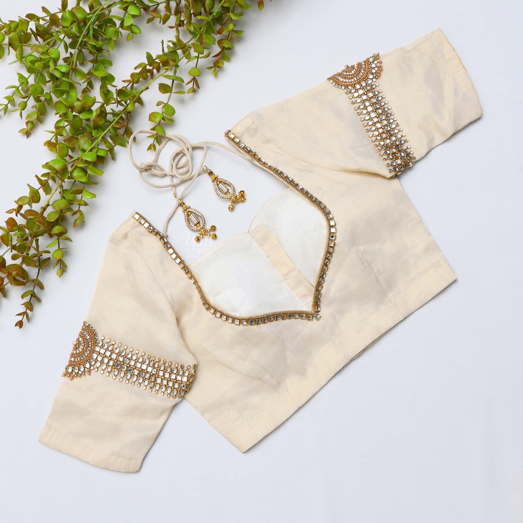 Intricately embroidered blouses in beautiful sandel hues. Stitching