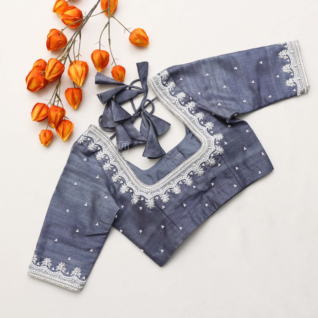 Stunning dark blue blouse adorned with elegant white shade embroidery Stitching