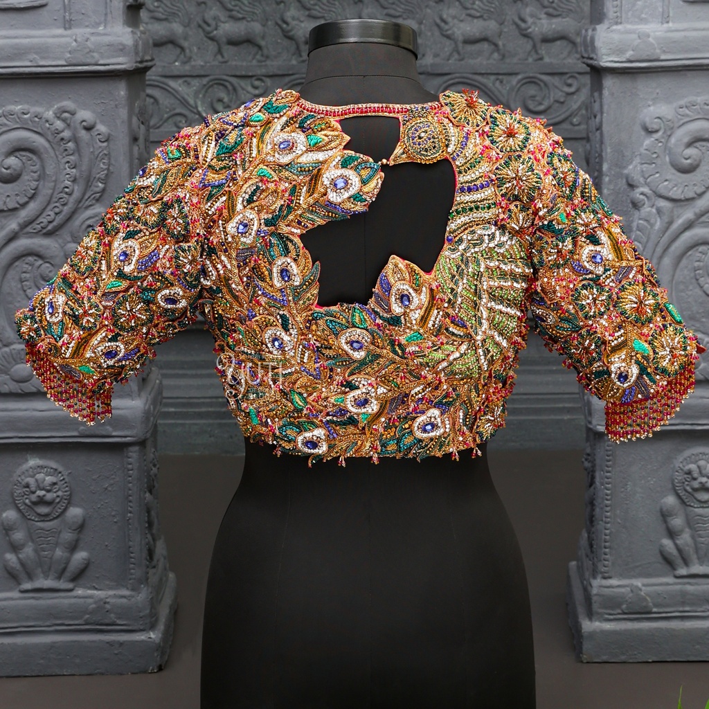 The allure of peacock-inspired embroidery on our elegant bridal blouse Stitching