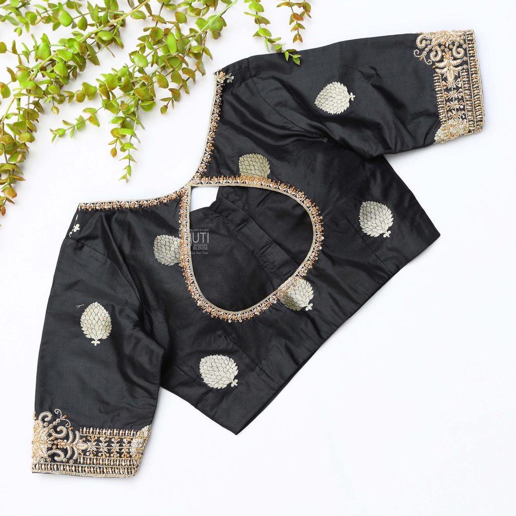 This black silk blouse adorned with intricate gold embroidery Stitching