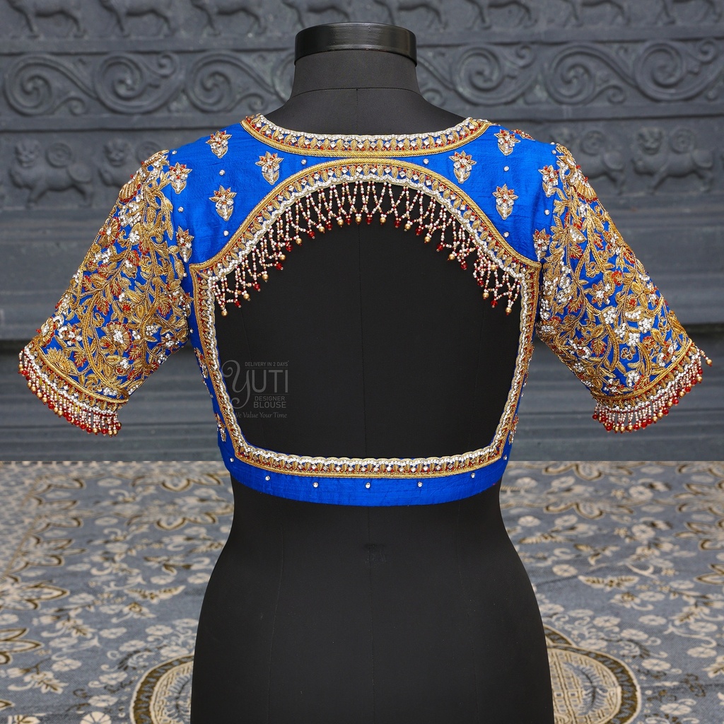 Unveil the beauty of dark blue open back embroidery bridal blouse. Stitching