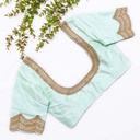 Exquisite craftsmanship meets refreshing hues in this mint green blouse