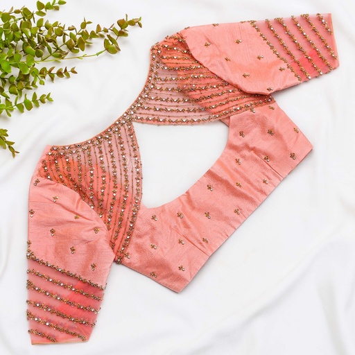 A pink blouse with gold beads Stitching