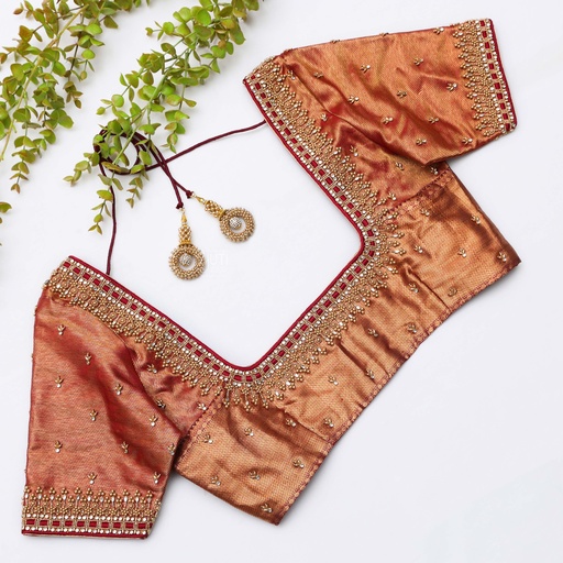 Beauty of traditional craftsmanship with orange blouse Stitching