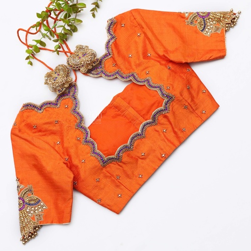 Bringing sunshine vibes with this vibrant orange blouse Stitching