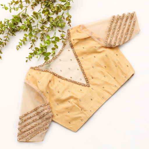 Elegance personified in this exquisite peach bridal blouse Stitching