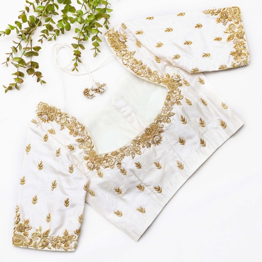 Feeling chic and elegant in my white blouse with gold embroidered details. Stitching