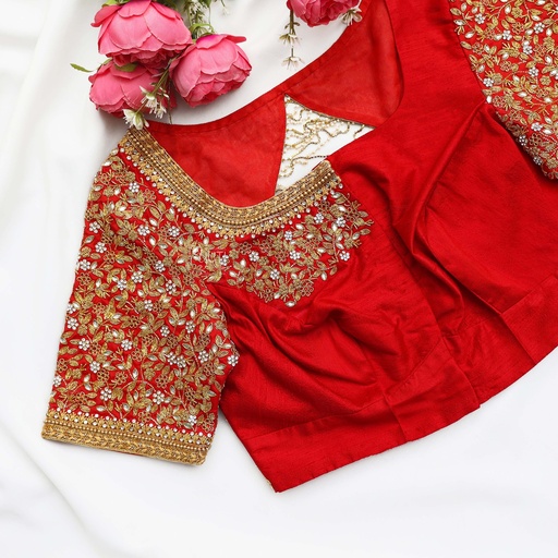 Festive red blouse embellished with gold sequins and lovely flowers. Stitching