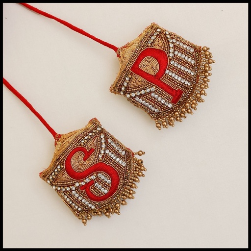 Red initial tassel Stitching