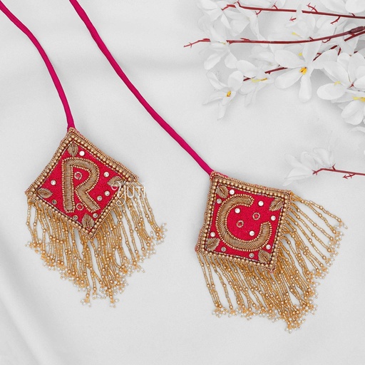 Red initial tassel Stitching