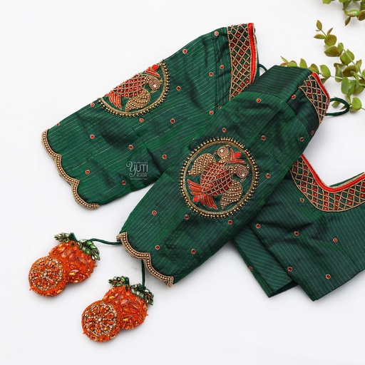 Resplendent green blouse adorned with exquisite red and orange embroidery Stitching