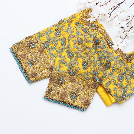 Step up your style game with this captivating yellow embroidery blouse Stitching