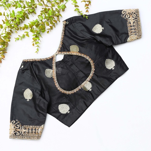 This black silk blouse adorned with intricate gold embroidery Stitching