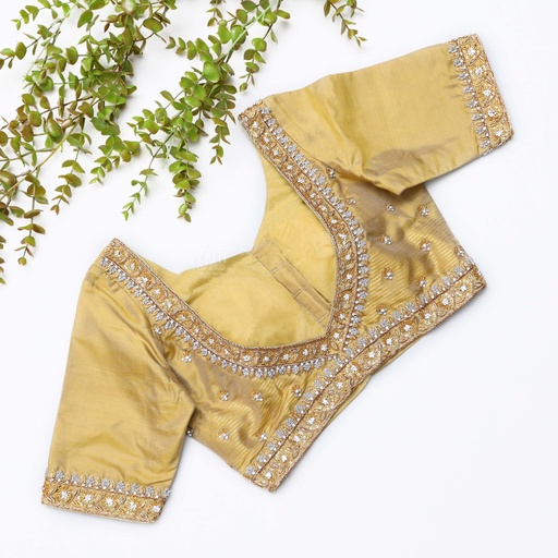 This gold embroidered blouse with beading is the perfect choice Stitching